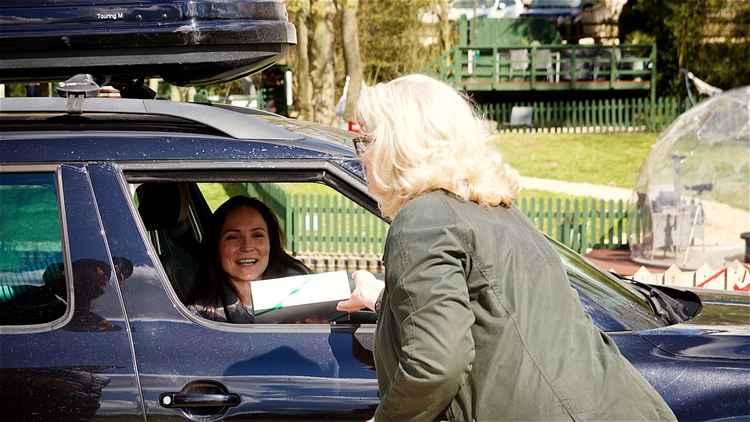 Owner Jo Carroll personally greets guest with a sweet treat to celebrate Winchcombe's reopening