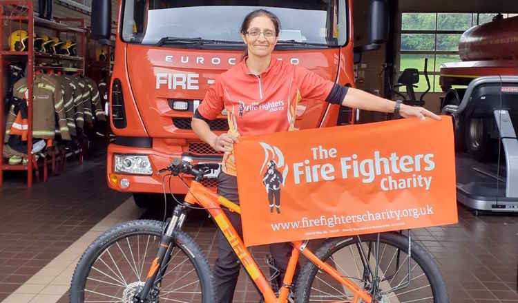 Alison will cycle between all 17 Warwickshire fire stations this weekend