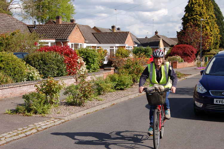 Jennifer delivering activity packs by bicycle