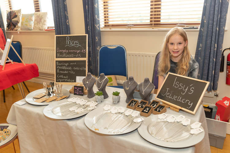 Issy Foyle, 12, with her handmade jewellery stall. Photo by Victoria Jane Photography.