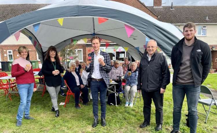 (Centre) Magician Angus Baskerville, (L-R) Pauline Hayward (Compassionate Kenilworth), Susan Greenway (VASA), Cllr Richard Dickson, and Edward Allard (Cadent) and residents at last week's coffee morning