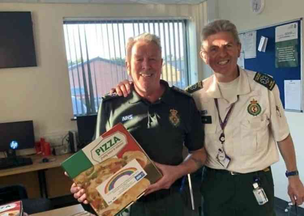 Swadlincote Ambulance Station with their gift of pizzas from Zamani's