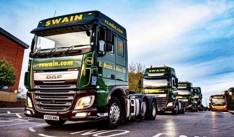 Convoy of trucks on its way through Swadlincote