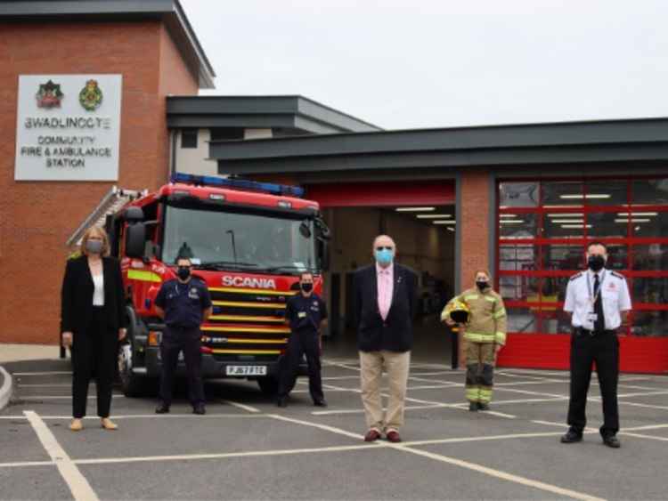 Christine Fearns (front left), William Saunders (front middle) and Gareth Murtagh (front right) with staff at Swadlincote Community Fire and Ambulance Station