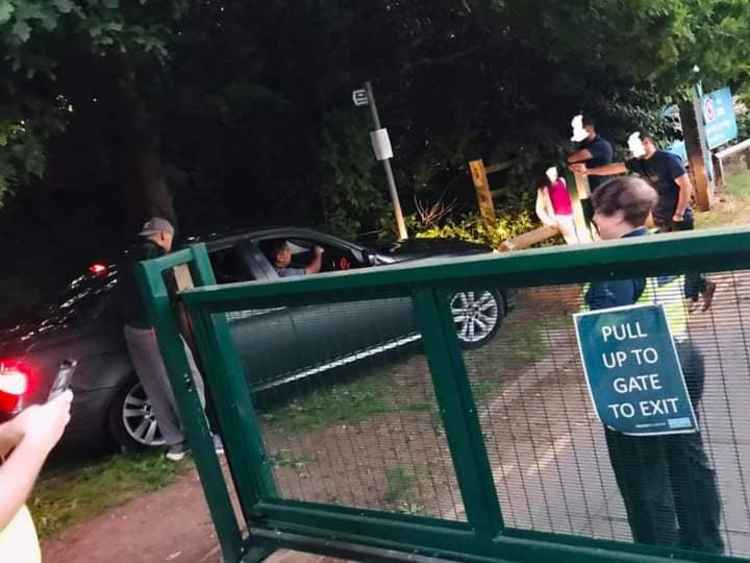 Officers attend to a family whose vehicle was trapped on the site when the barriers shut. Photos: Swadlincote SNT