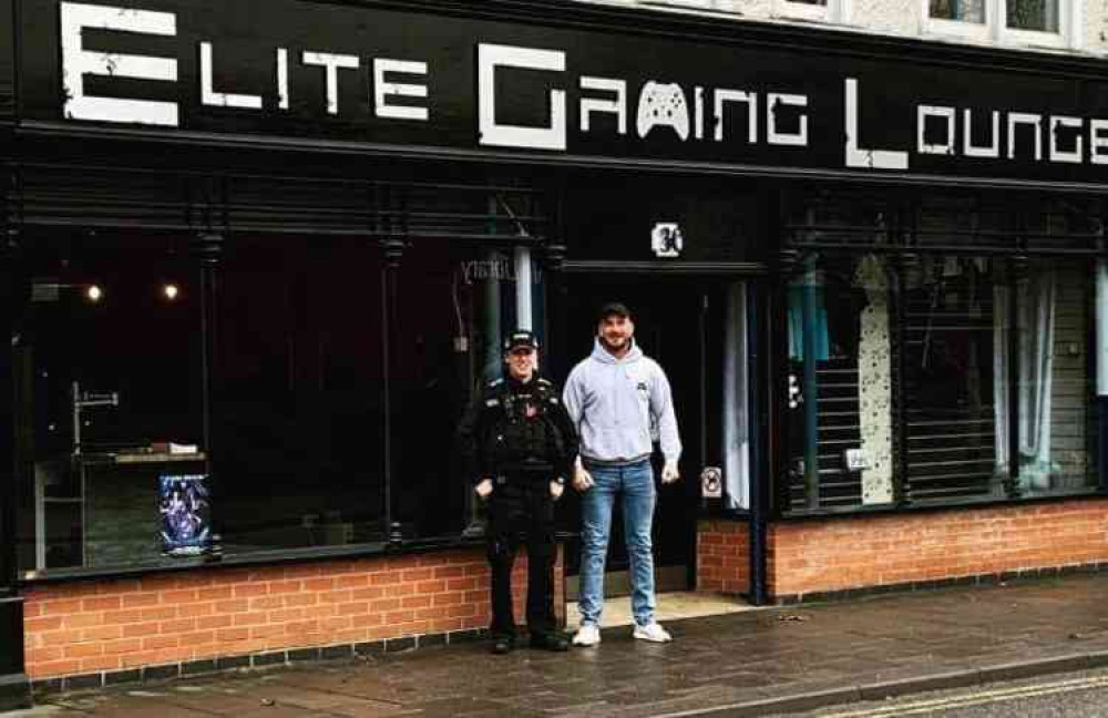 PCSO Nick Bromley and owner Harry Kenyon outside Coalville's Elite Gaming Lounge