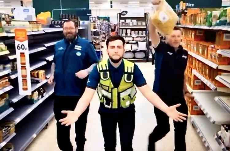 Dan Wright and Morrisons staff in a scene from the video