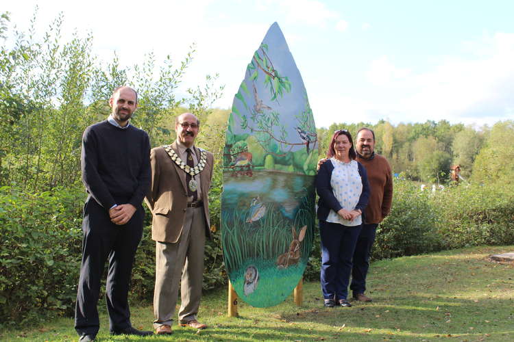 L - R Councillor Andrew Woodman, Chairman of NWLDC, Councillor Virge Richichi, Nicky Carlton, General Manager at Conkers and Chris Sturdy, Operations Director at Planning Solutions in front of Kayleigh Bradley's design, 'The Blue Flamingo.'