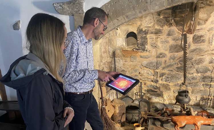 Museum visitors playing the interactive game at the 1620s House and Garden