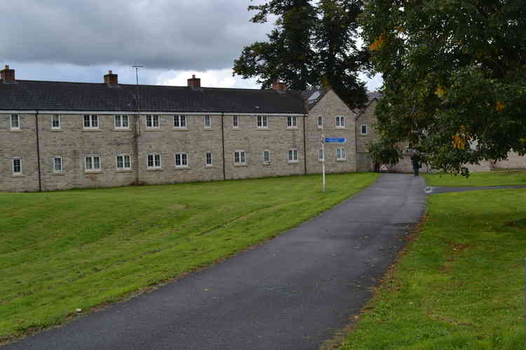 To the left of the green is the proposed building