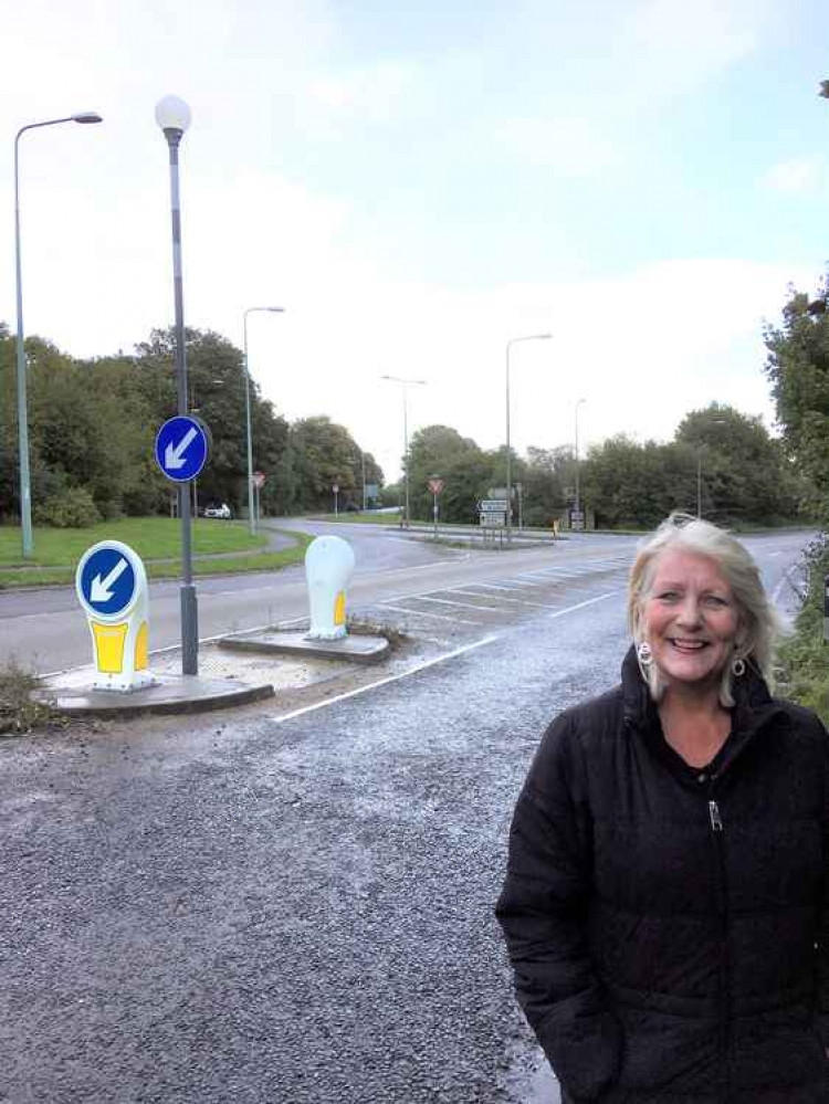 Cllr Karen Walker, the Chair of B&NES Council's Environment Committee, is pictured next to the new bollards at the Bath Road entrance to Peasedown St John.