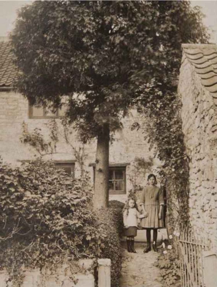 Nora and Mary West on the path from Durcott Lane, Camerton to the family home,c1925