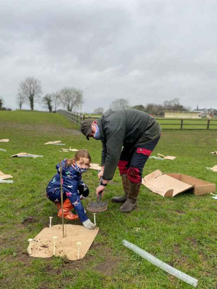 Community Trust Chairman, Gavin Heathcote and his daughter Hope, get ready for Peasedown's mammoth tree planting plans