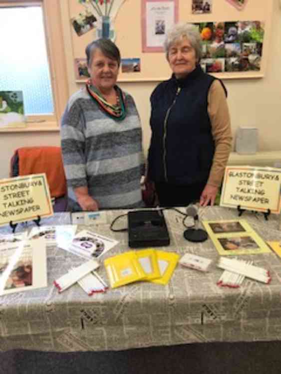 Volunteers man the information table at the Discover Your Community Event in Street