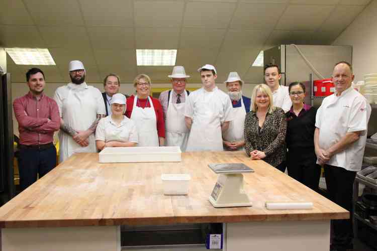 Burns the Bread family with Henry Jefferies (craft baker) and the apprentices with Katy Quinn (Strode College principal), David Byford (director of employer engagement) and Paul Bentley (hospitality assessor/trainer at Strode College)