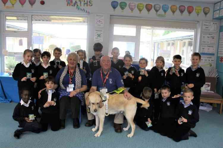 The pupils with Alex from Guide Dogs and his dog Homer last term