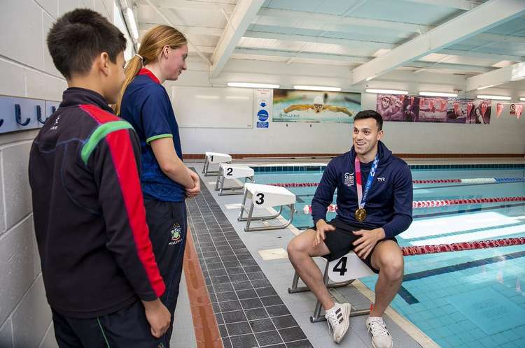 James Guy talking with current Millfield Prep pupils Asta and Andrew