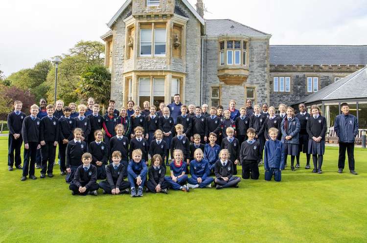 James Guy with Millfield Prep pupils