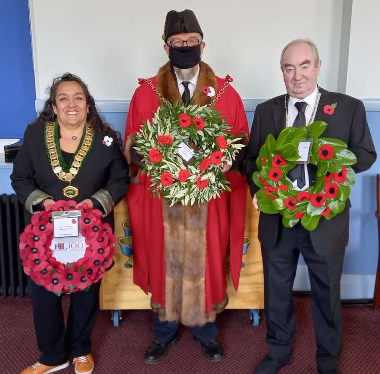 Cllr Laura Wolfers, Chair of Street Parish Council (left), Cllr Jon Cousins, Mayor of Glastonbury Town Council (centre), Cllr Nick Cottle, Deputy Chair of Mendip District Council (right) in Glastonbury for Remembrance Day 2021