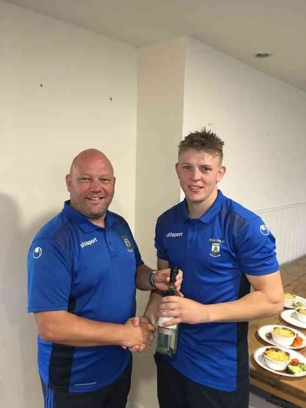 Vice-chairman Mark Phipps presenting the man of the match award to skipper and hat-trick hero Ross Padfield