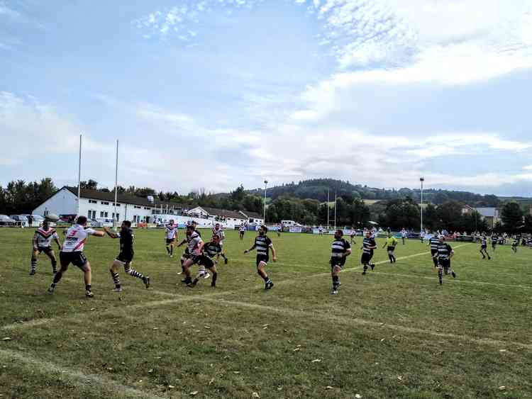 Wells (in white) in action at Minehead