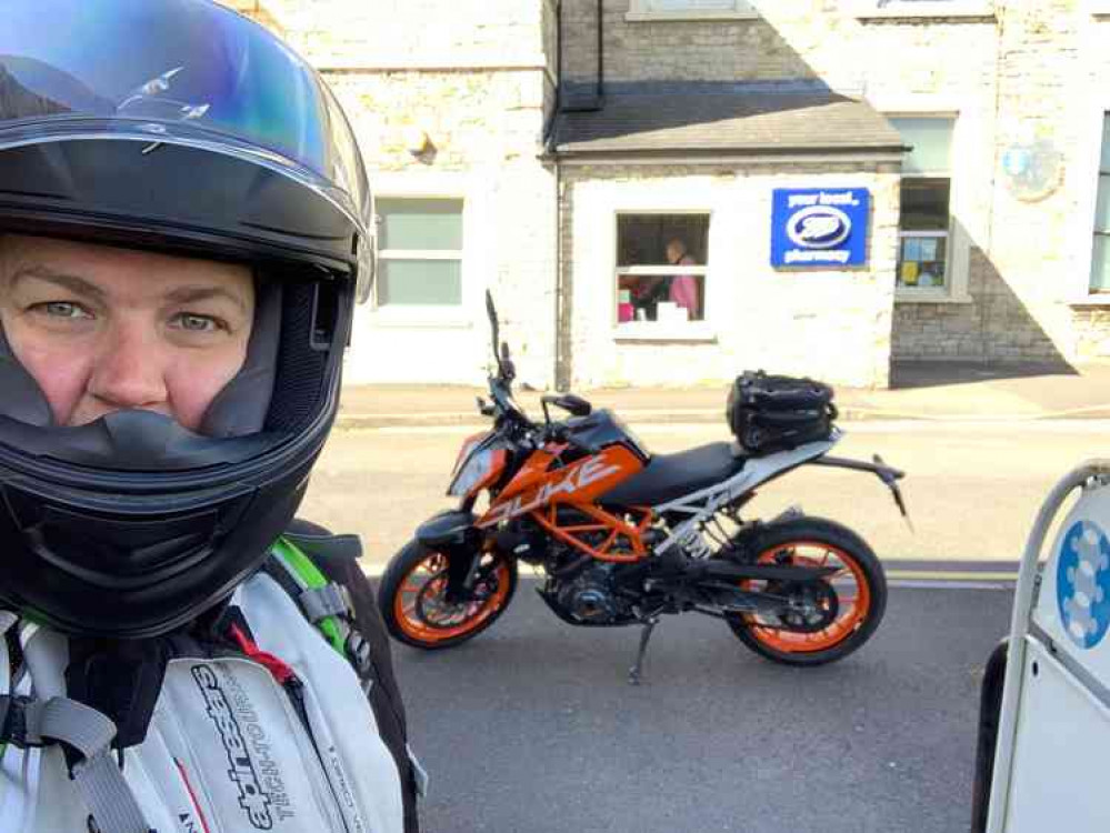 Naomi Sharp with her motorbike outside the Boots pharmacy on the Priory Health Park