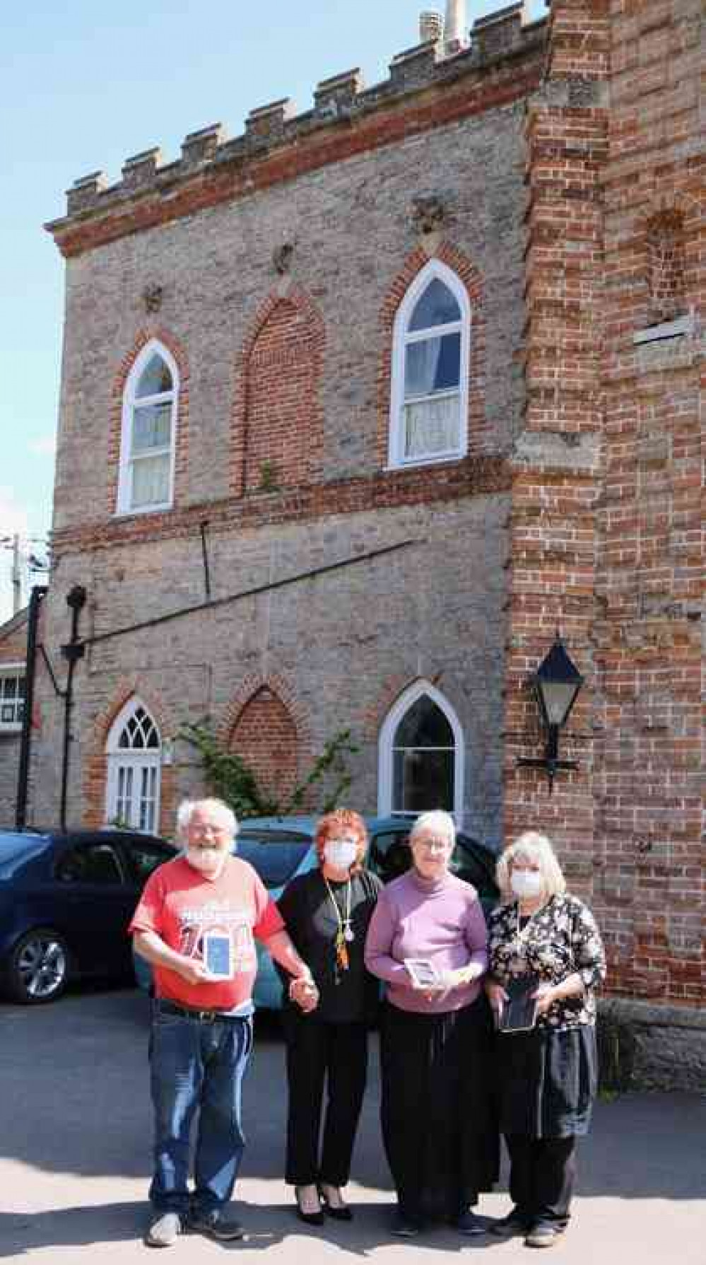 Christine Blair with three Mellifont Abbey residents holding the tablets