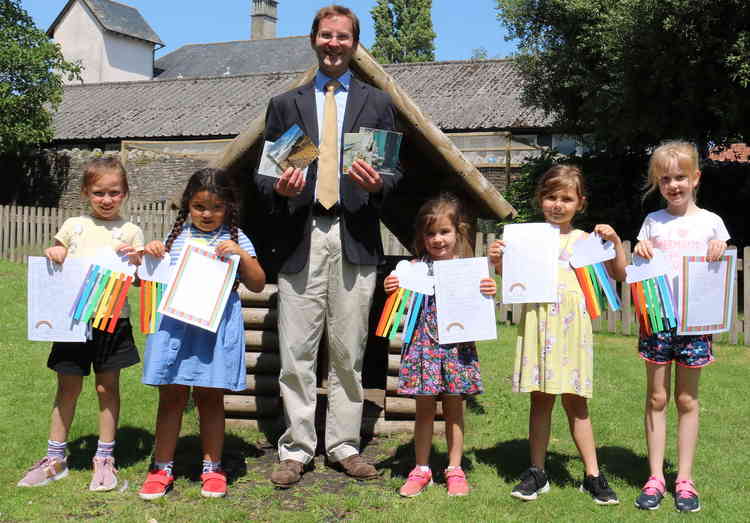 Head master Alastair Tighe with pre-prep pupils and their letters