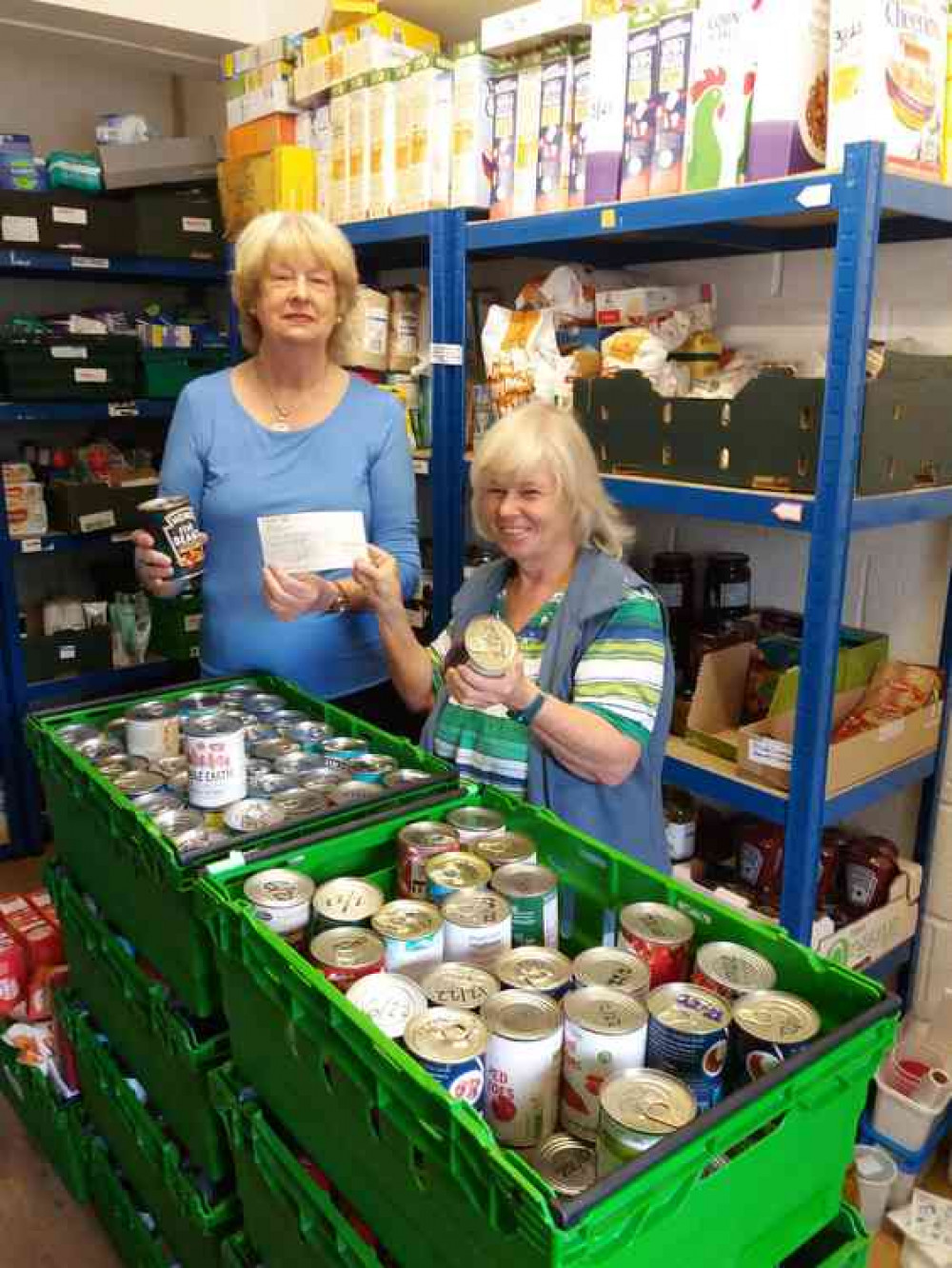 Margaret Wright, on the left, presents the £500 cheque to Sue Marland