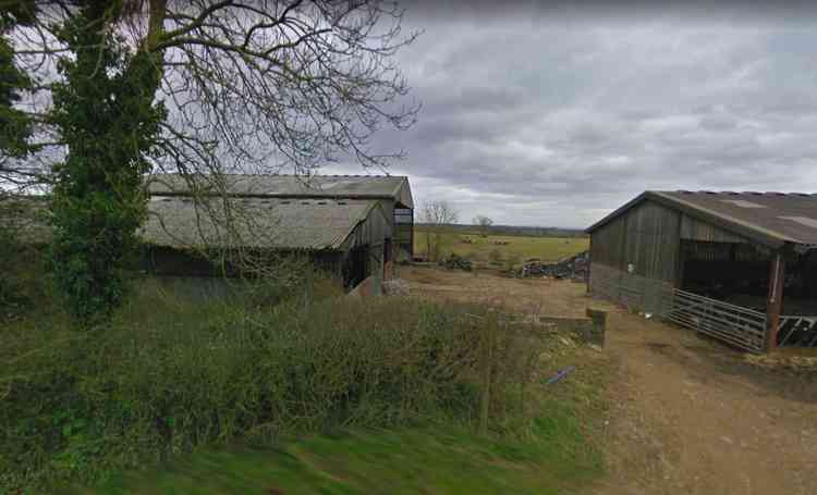 The footpath sign and barn at Crapnell Farm (Photo: Google Street View)