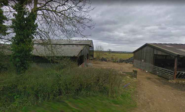 Looking towards the barns in Dinder that will be removed and converted into homes (Photo: Google Street View)