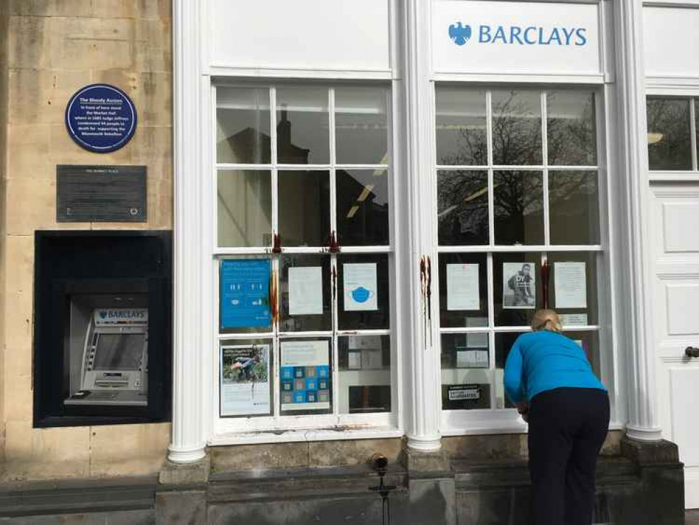 Fake oil on the window frames of Barclays in Wells, staff having already cleaned it off the windows