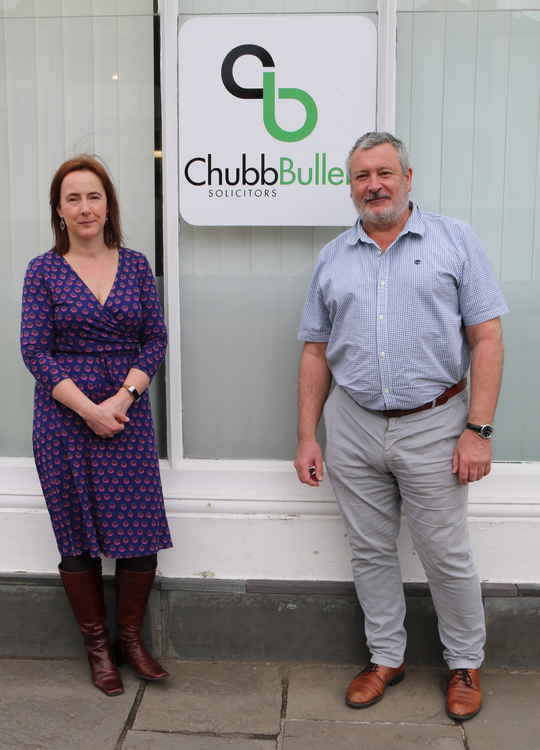 Bruce and Heather Scobie outside Chubb Bulleid's Wells Market Place office