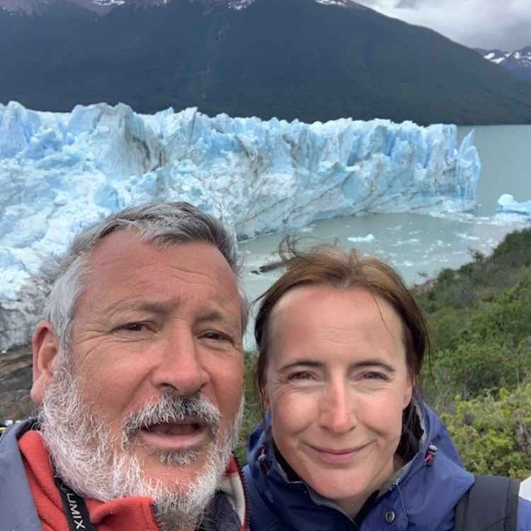 Bruce and Heather love travelling. Here they are on holiday in Patagonia with a glacier in the background