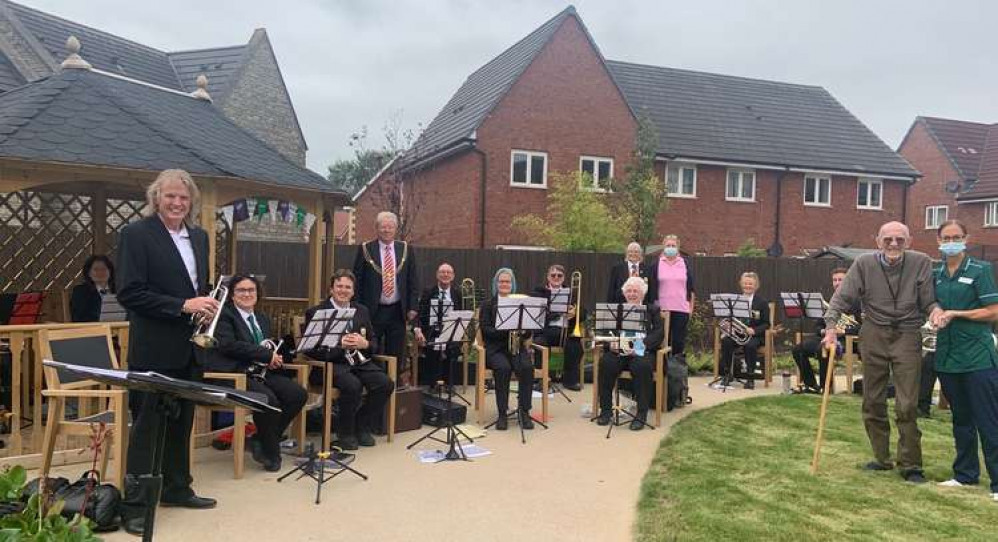 Wells City Band takes a break for the photographer