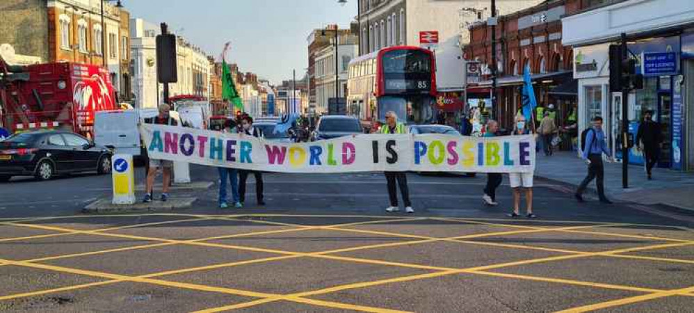 Previous XR action in Putney. A banner like this is due to be used tomorrow.