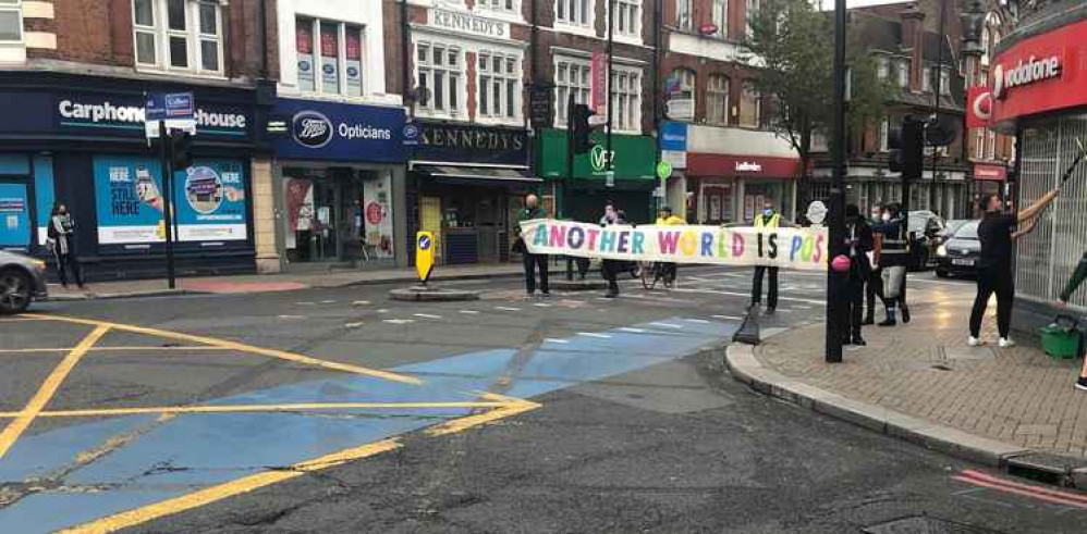 Extinction Rebellion holding a 'Green Man Swarm' on Tooting Broadway (8th Oct)