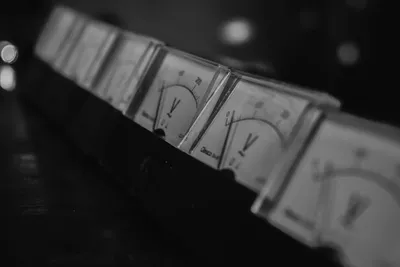 Abstract Numr artwork: a row of analogue gauges, two lit.