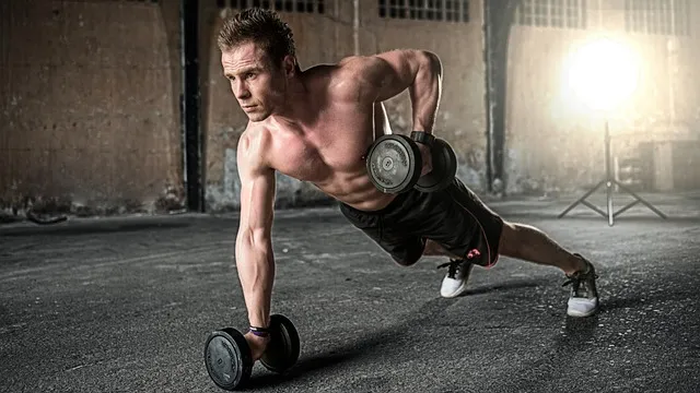 An athlete performing a hybrid workout combining weightlifting and plyometrics.