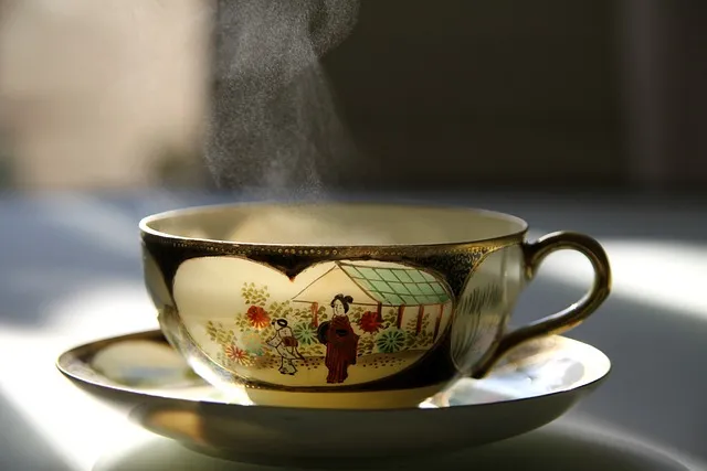 Capsules of green tea extract and a cup of coffee.