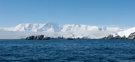 Antarctica, rocks & snow-capped mountains