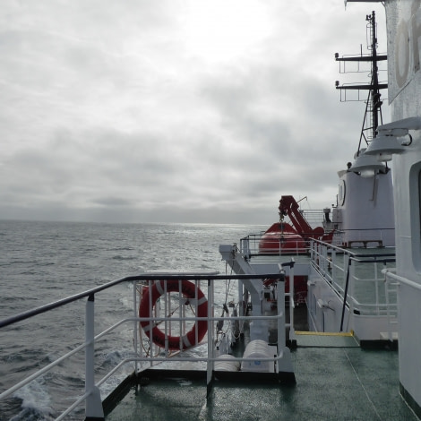 OTL27-17_28Jan, Day 16 Victoria Salem. Sun appearing behind cloud-Oceanwide Expeditions.JPG