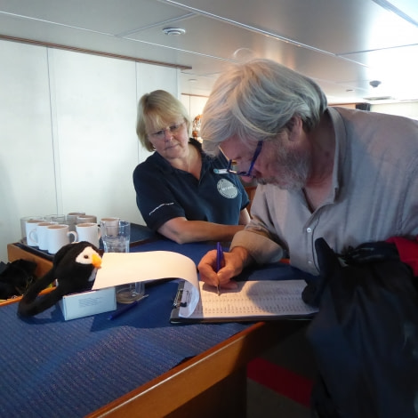 OTL28-17, Ross Sea,Day 7 Victoria Salem. Signing the biosecurity list-Oceanwide Expeditions.JPG