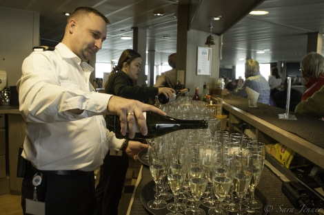 PLA25-18 EMBARKATION, bubbly pouring -Oceanwide Expeditions.jpg