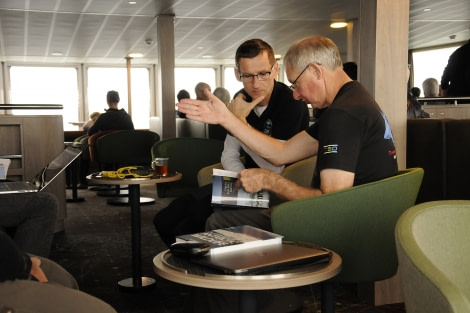 PLA23-18, 8 DEC, Fritz patiently listens to our passenger's lectures -Oceanwide Expeditions.jpg