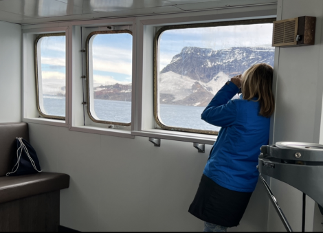 OTL23-22, Day 4 Guest looking out of the bridge - Hazel Pittwood © Hazel Pittwood - Oceanwide Expeditions.PNG