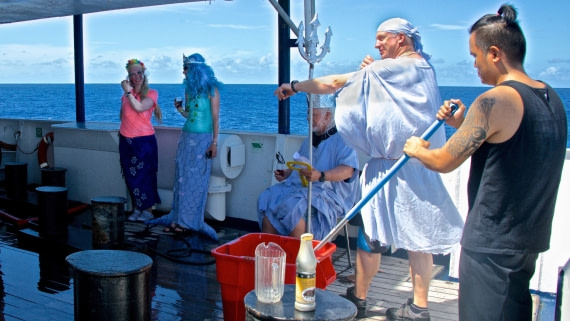 M/V Plancius guides, chef, crew member mixing "intiation CHUM" for 1st crossing equator at sea, atlantic odyssey 22017
