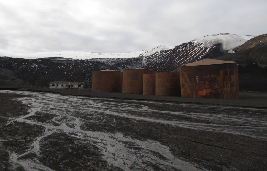 Rusty old whale oil tanks in Whalers Bay, Deception Island