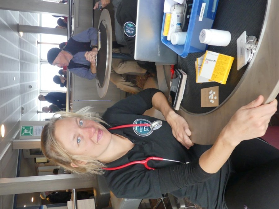 PLA23-18, 20 DEC, Doctor with medication -Oceanwide Expeditions.jpg