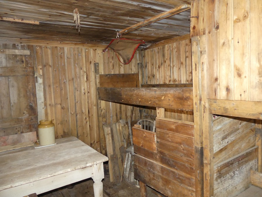 OTL27-20, Cape Adare, Inside hut left - bunks & table, Victoria Salem -Oceanwide Expeditions.JPG